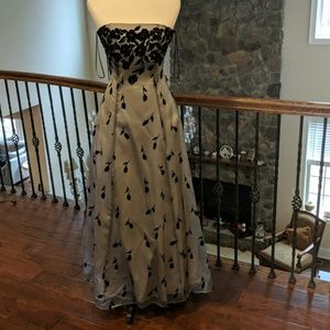 A gray and black full length strapless ball gown